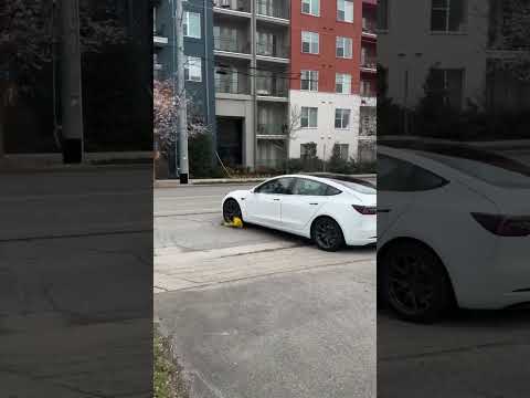Absolute idiot drives away with boot on his wheel