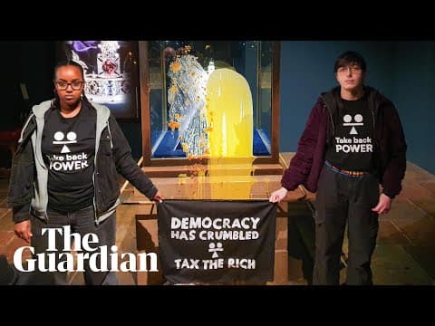 Moment activists throw food at the crown jewels display case in the Tower of London