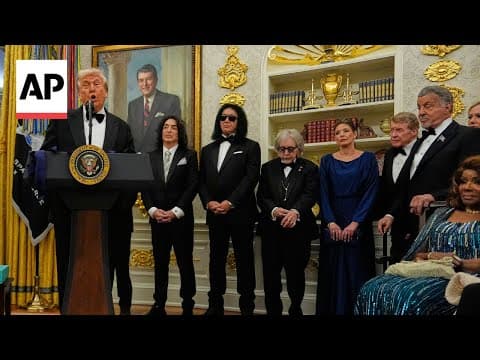 Trump awards medals to Sylvester Stallone, Gloria Gaynor, George Strait, Kiss and Michael Crawford
